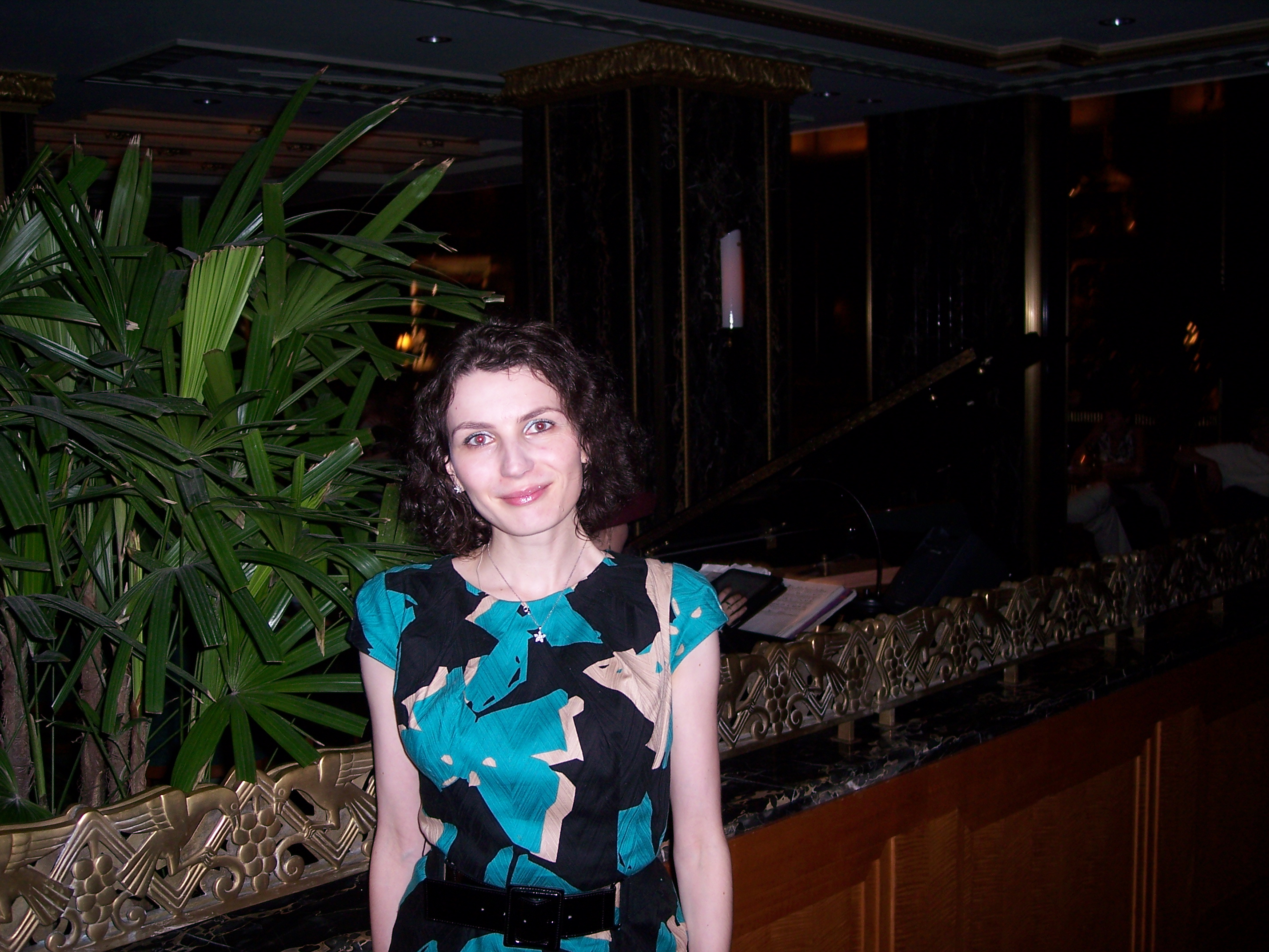 Mariya_in_front_of_plant.JPG
